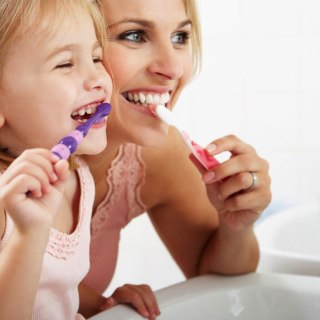 child brushing teeth